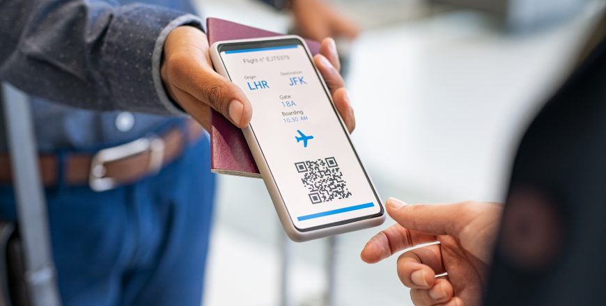 Man showing digital flight e-ticket to stewardess